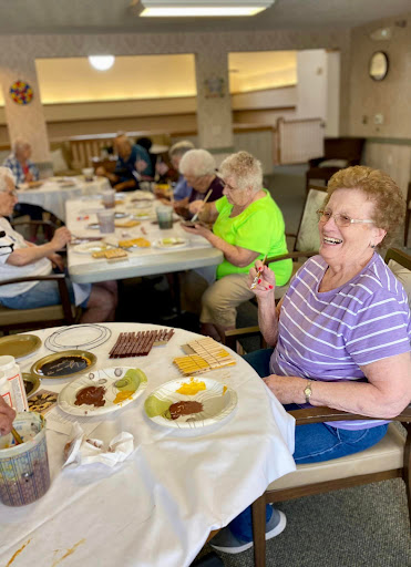 Seniors enjoying a meal together at a community dining event.