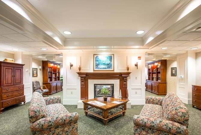 A cozy living room with comfortable seating and a fireplace.