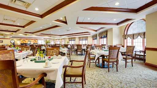 An elegant dining area featuring well-arranged tables and comfortable seating, perfect for a pleasant meal.