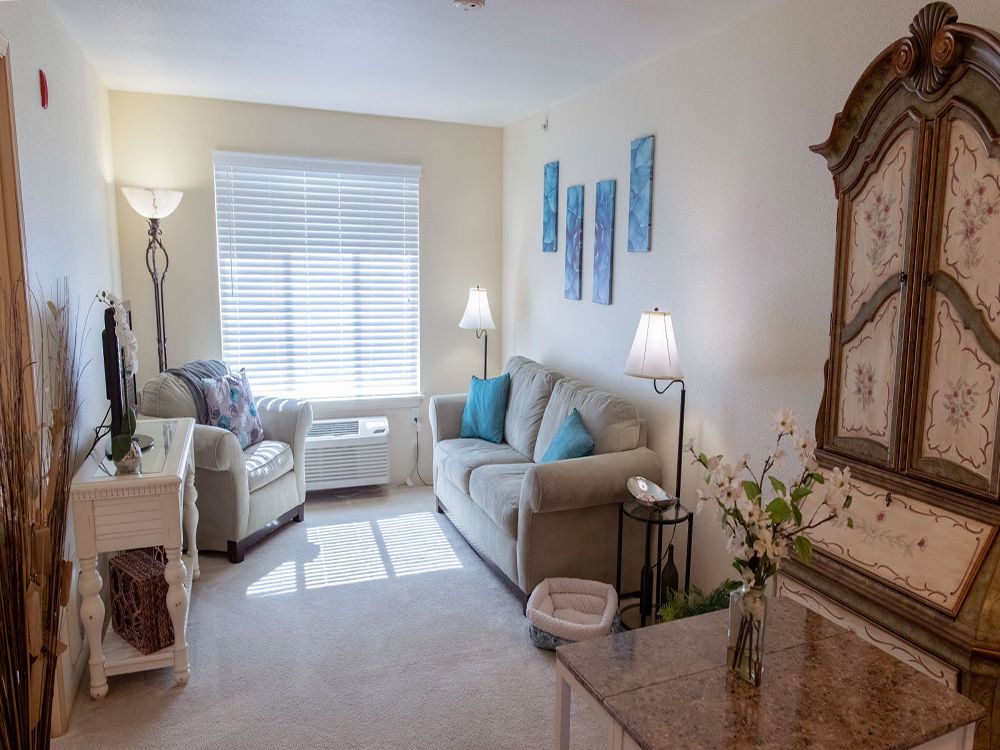 A cozy living room with comfortable seating and elegant decor.