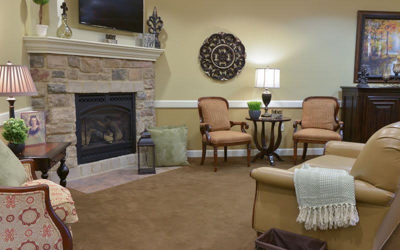 Cozy living room with a fireplace and comfortable seating area.