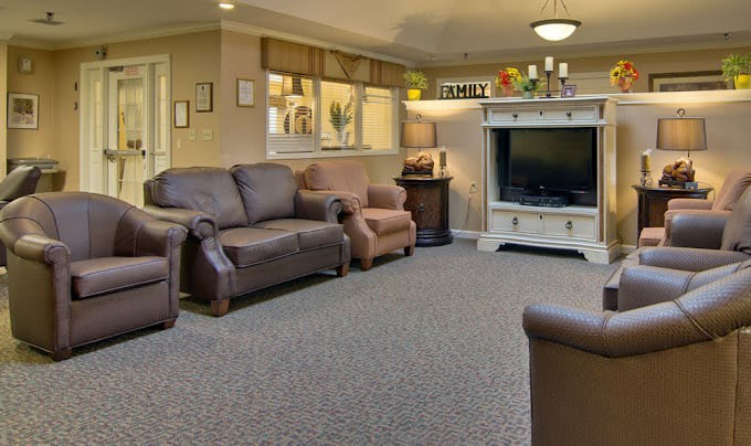 Cozy living room with comfortable seating and a large television.
