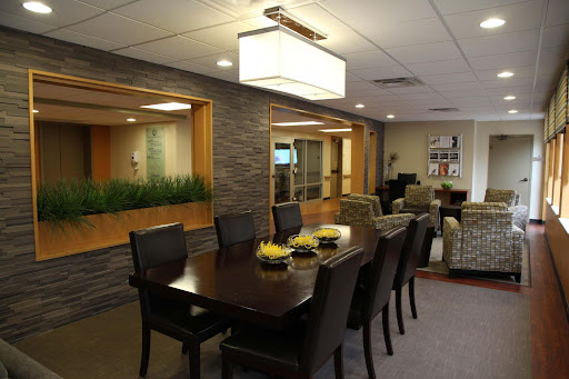 A stylish dining area featuring modern furnishings and ambient lighting.