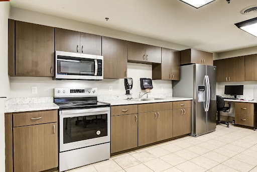 A modern kitchen featuring stainless steel appliances and sleek cabinetry.