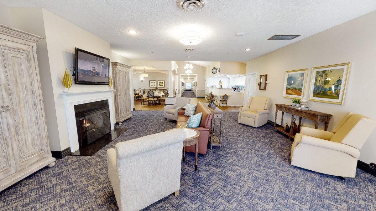 A cozy living room with comfortable seating and a fireplace.