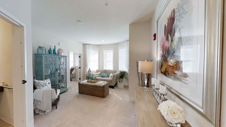 A cozy and stylish living room with modern furniture and decorative elements.