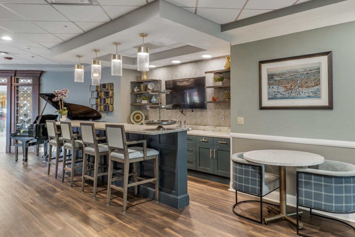 A modern home bar with elegant lighting and seating.