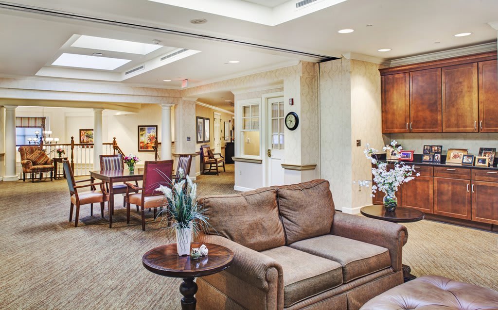 A cozy living room with comfortable seating and soft lighting.