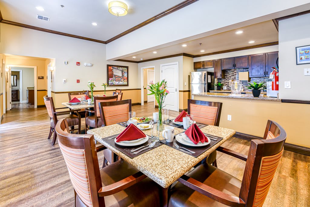 A well-decorated dining area with a neatly set table in a cozy interior.