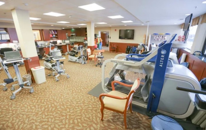 A rehabilitation clinic featuring various therapy and exercise equipment.