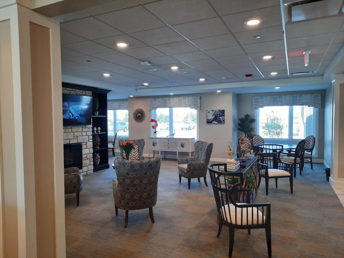 A cozy lounge area with comfortable seating and a television.