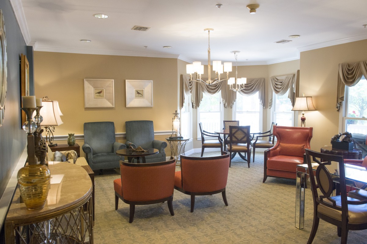 A well-decorated living room with elegant furniture and lighting.
