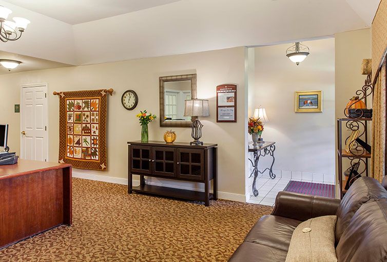 A cozy living room with a mix of classic decor and comfortable furnishings.