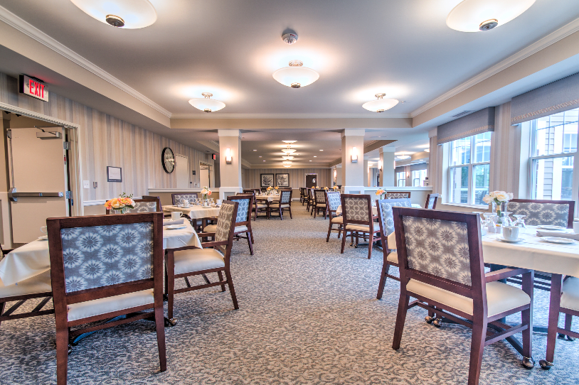 Spacious dining area with elegant furnishings and ambient lighting.