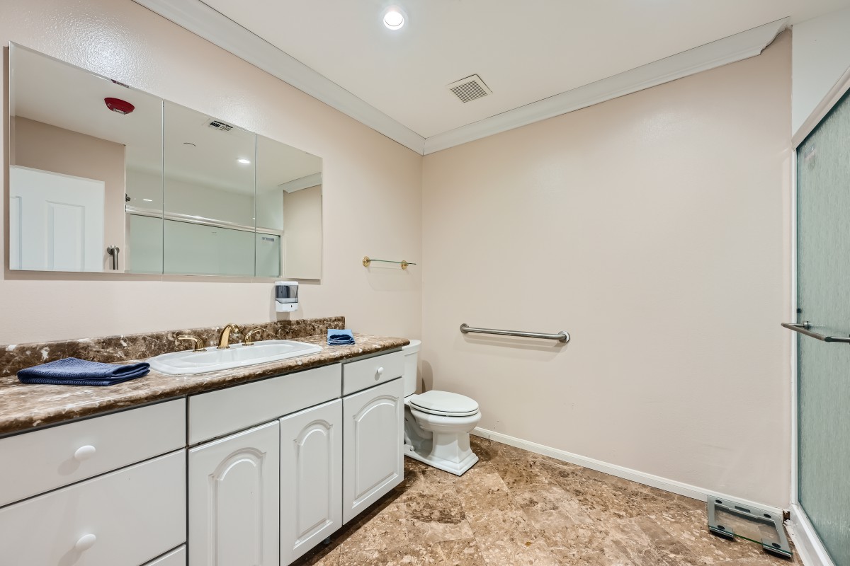A clean and spacious bathroom with modern fixtures.