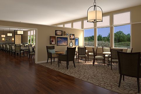A cozy dining area with large windows and elegant decor.