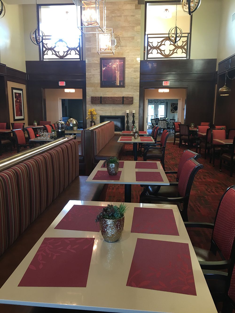 A cozy restaurant interior with neatly arranged tables and chairs.