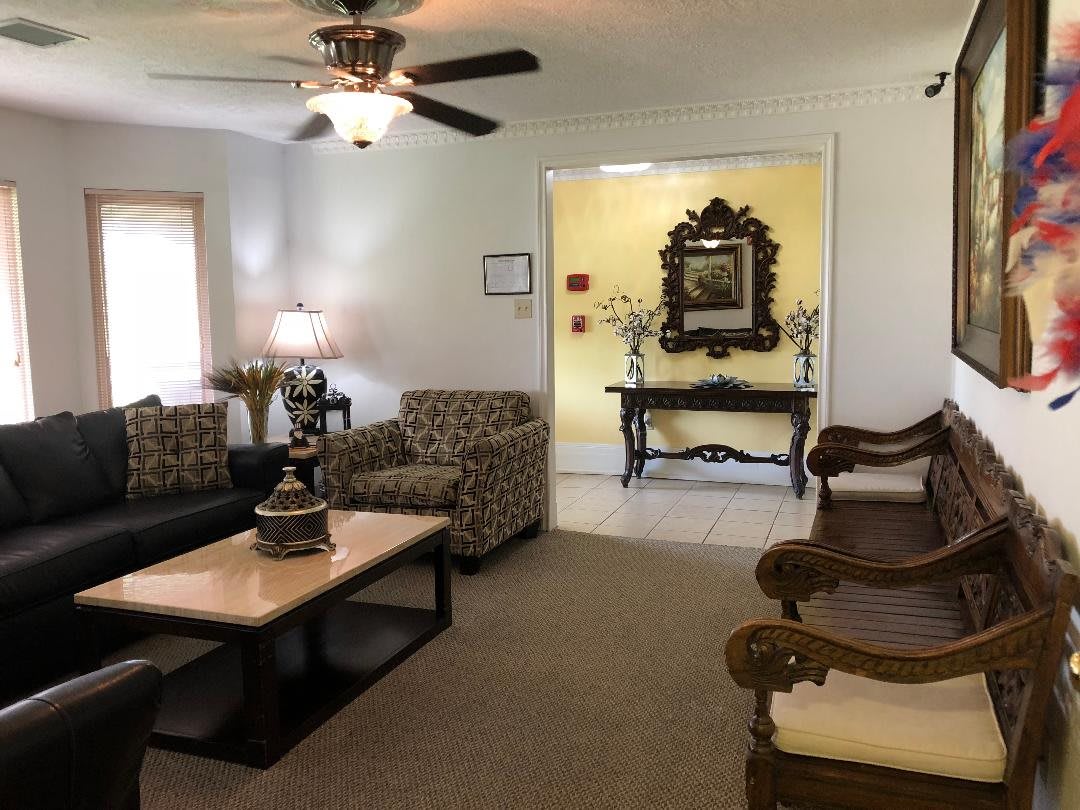 A cozy living room with stylish furniture and decorative elements.