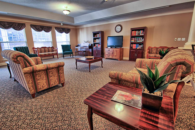 A cozy living room with comfortable seating and a television.