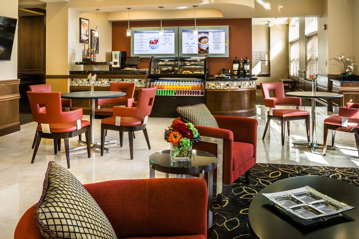 A modern cafe seating area with comfortable chairs and a relaxing atmosphere.