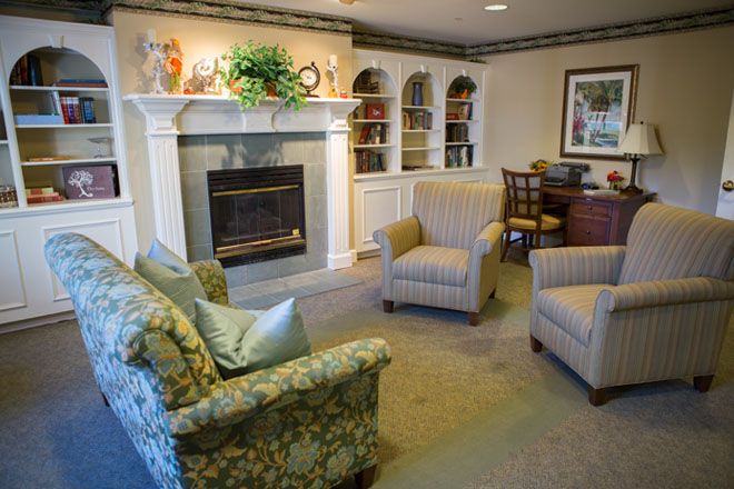 A cozy living room featuring comfortable seating and a fireplace.