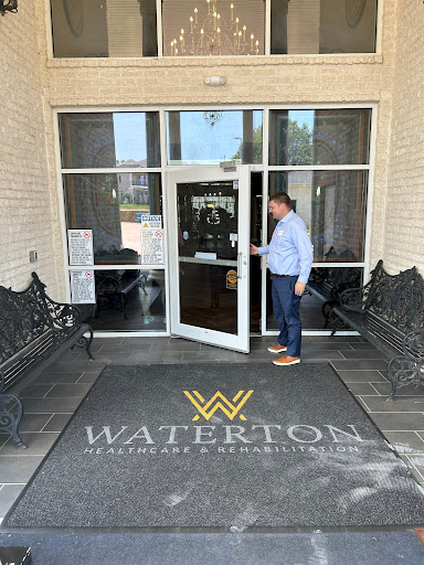 A man approaching the entrance of Waterton, ready to enter.
