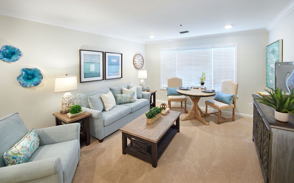 A modern living room with comfortable seating and a cozy dining area.