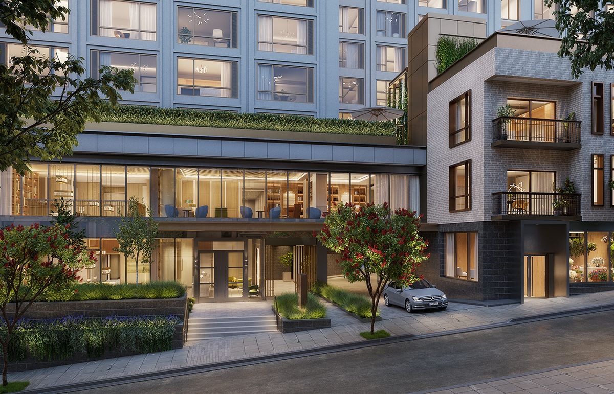 A modern apartment complex with large windows and a sleek exterior in an urban setting.