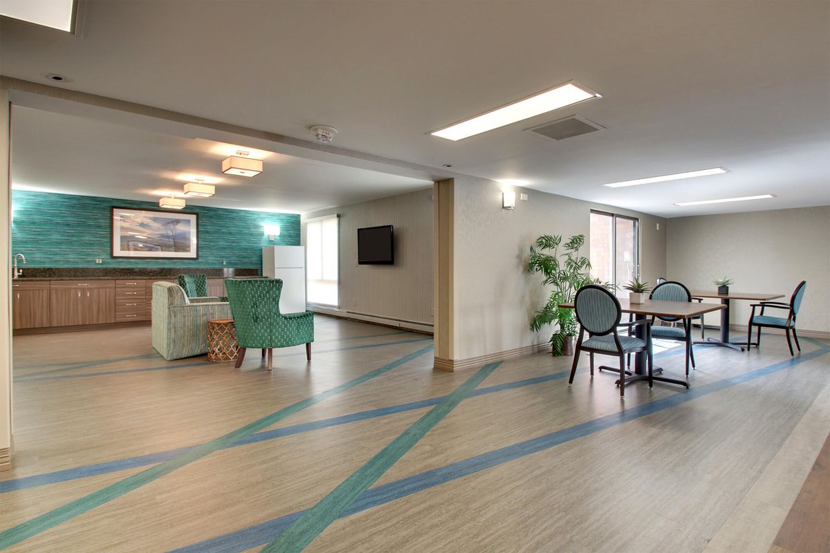 A spacious and modern open-plan living and dining area with stylish furniture and decor.