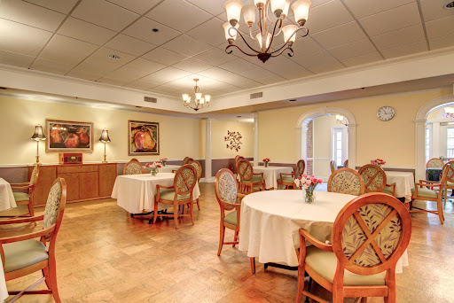 A beautifully designed dining room featuring elegant tables and chandeliers.