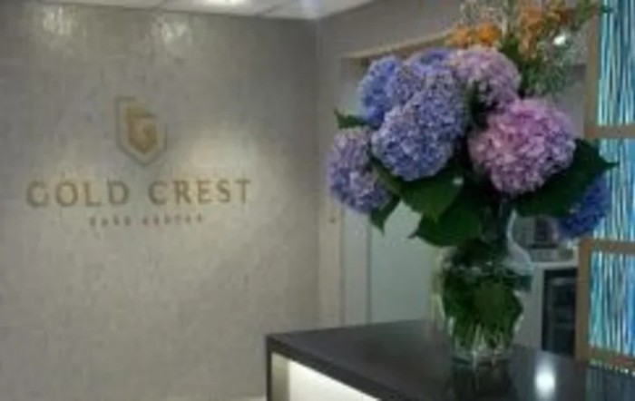 A well-decorated office reception area with a vase of colorful hydrangeas.