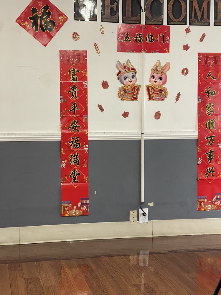 Wall decorated with Chinese New Year banners and rabbit illustrations.