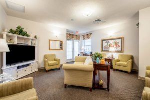A cozy living room with comfortable seating and a television.