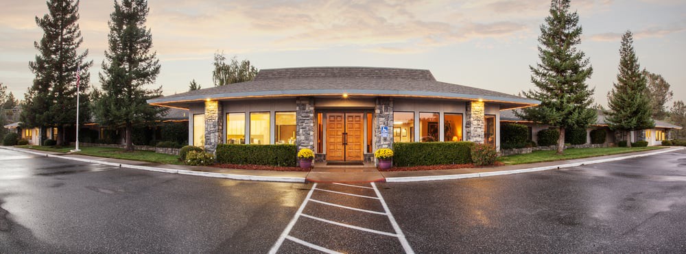 A cozy restaurant exterior with a welcoming entrance and well-lit windows.