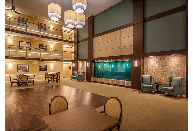 A spacious and modern hotel lobby with elegant lighting and comfortable seating areas.