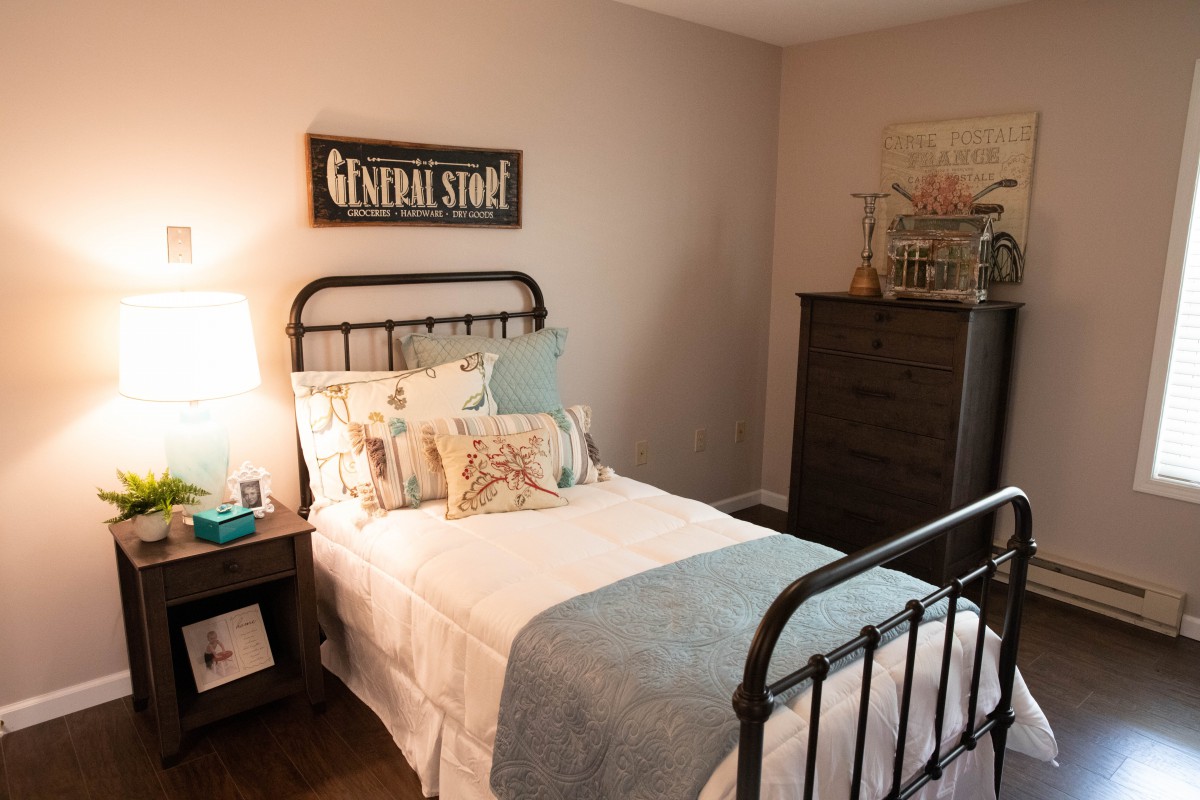Cozy bedroom with vintage-style decor and a comfortable bed.