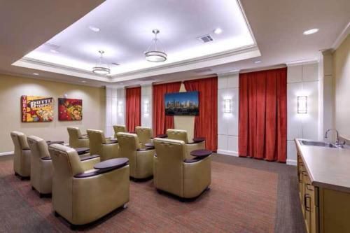 Luxurious home theater with comfortable seating and ambient lighting.