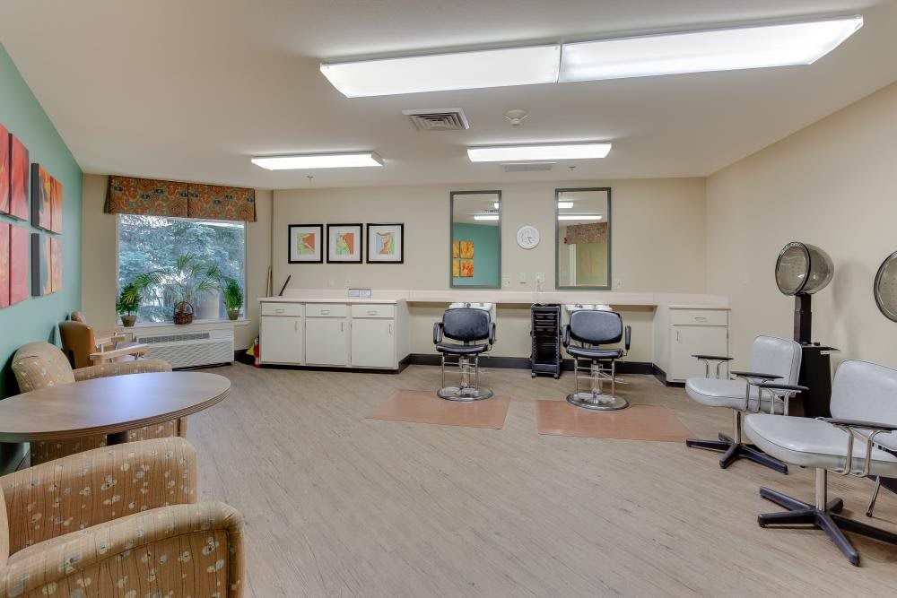 A bright hair salon interior with styling chairs and mirrors.