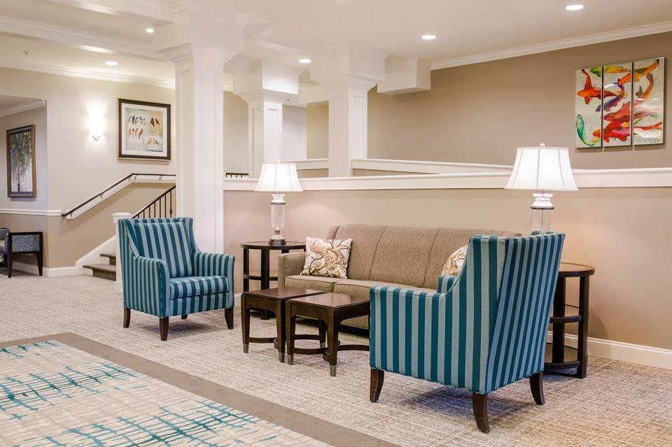 A cozy lobby area with comfortable seating and elegant decor.