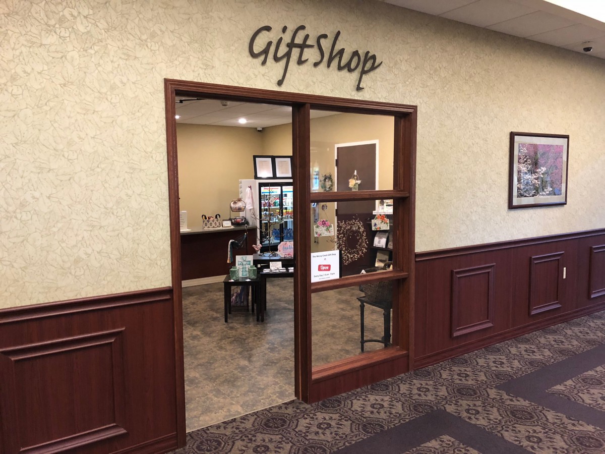 An inviting gift shop entrance with a view of interior shelves and products.