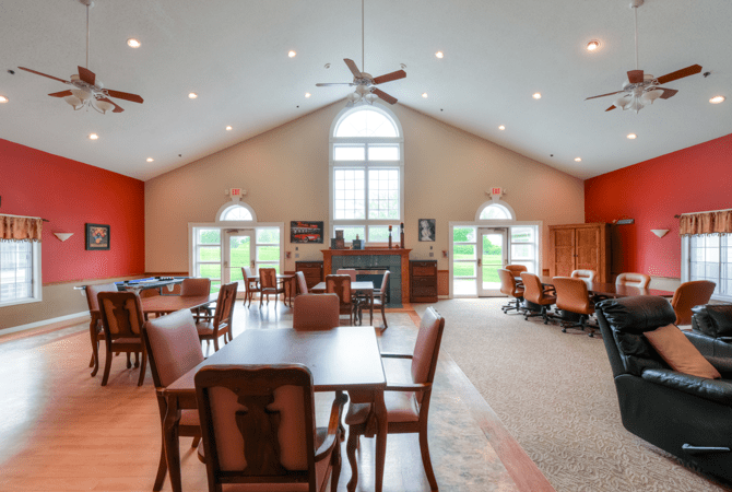 Spacious dining area with large windows and modern decor.