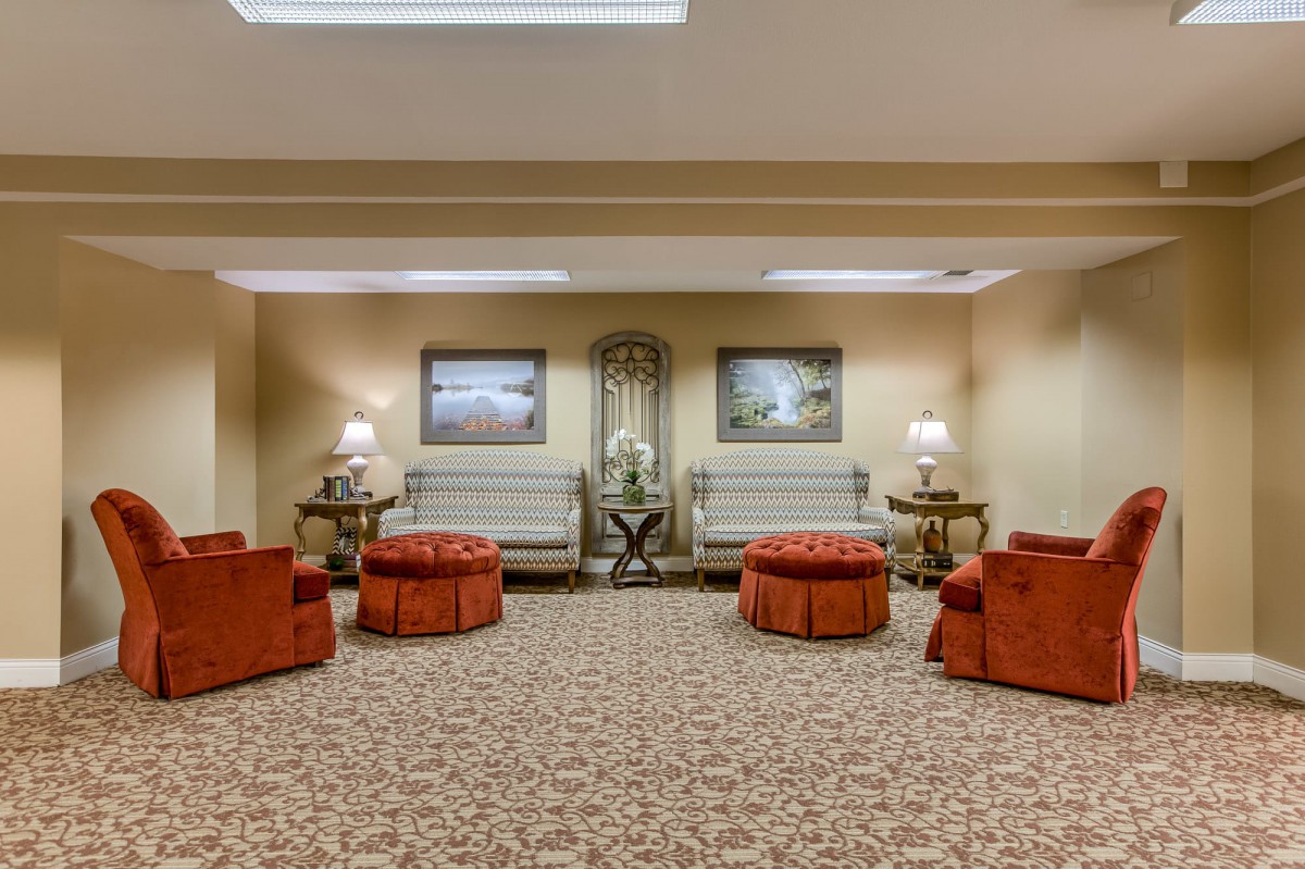 A cozy lobby area with elegant seating and decorative elements.