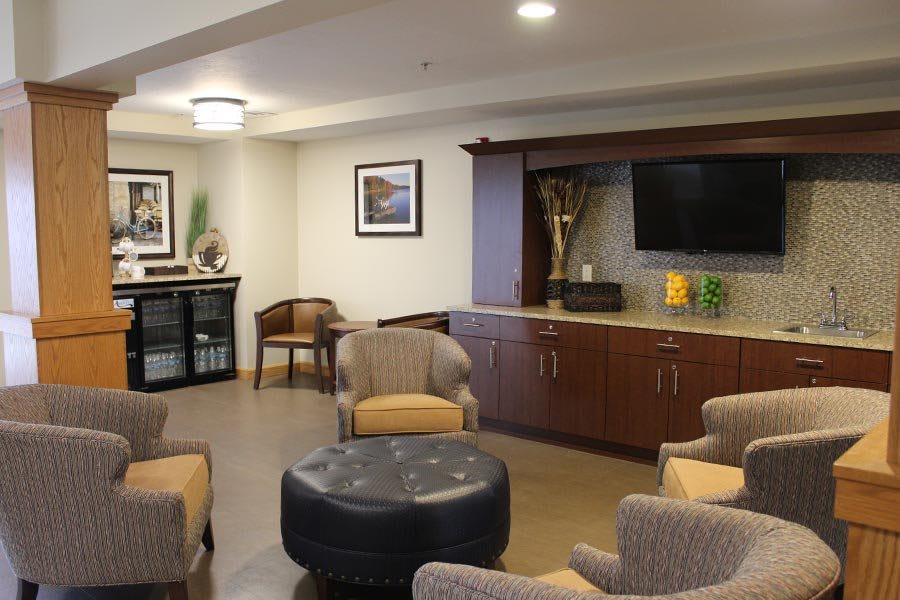 A cozy lounge area with comfortable seating and a television.