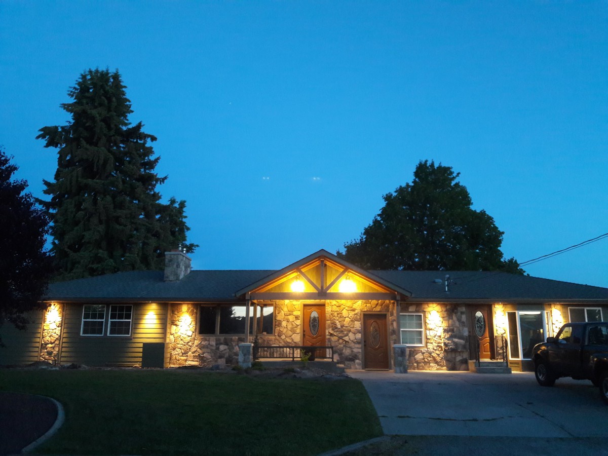 A warmly lit building against the evening sky.