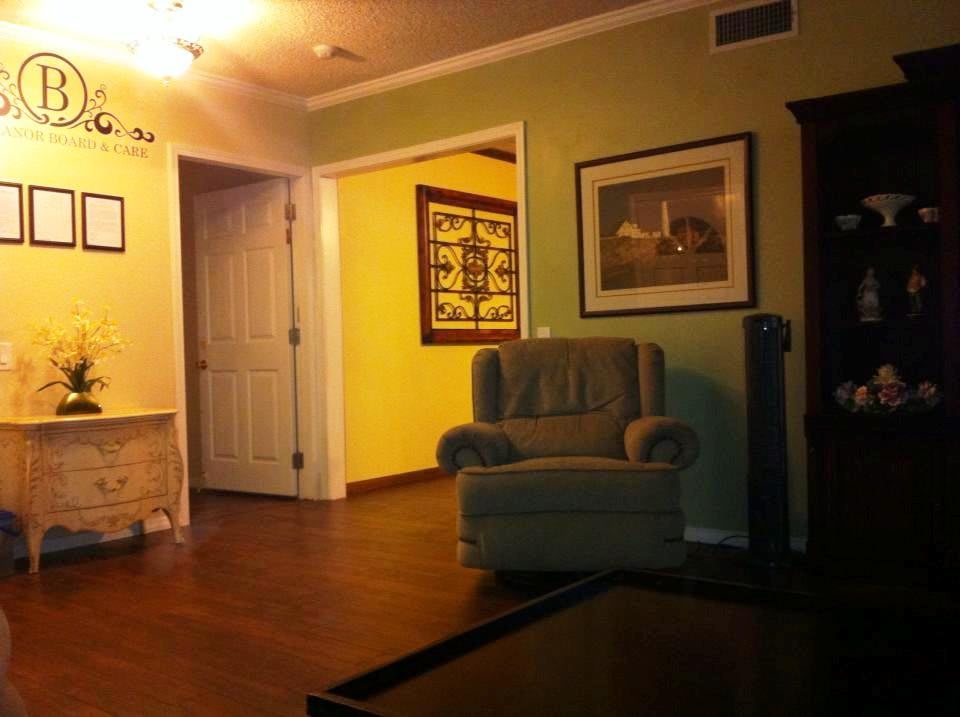 Cozy living room with an armchair and warm lighting.