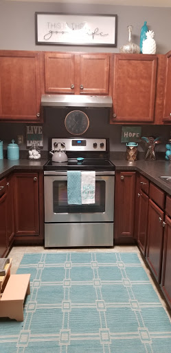 A beautifully organized kitchen featuring modern appliances and a charming decor.