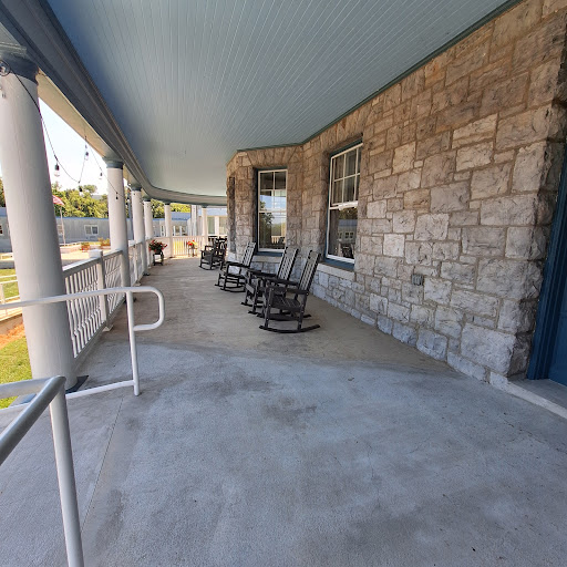 A serene porch featuring rocking chairs, ideal for enjoying a peaceful moment outdoors.