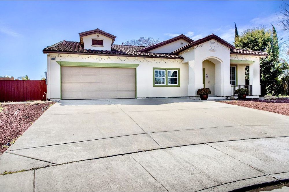 A beautiful single-story house with a double garage and spacious driveway.