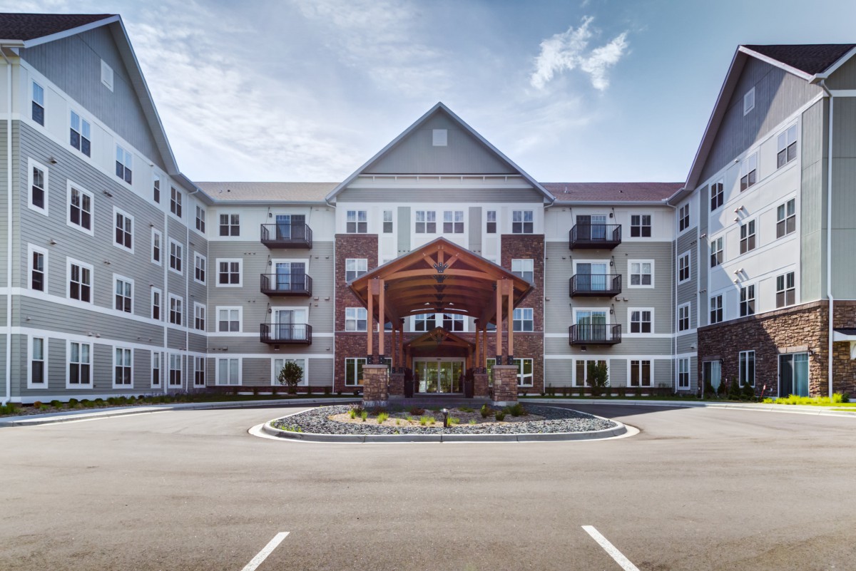 Modern residential building with a prominent entrance.