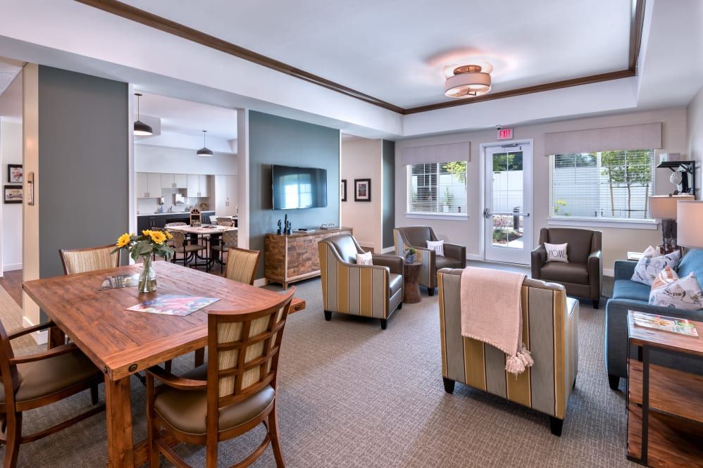 A modern living room with comfortable seating, a large TV, and stylish decor.